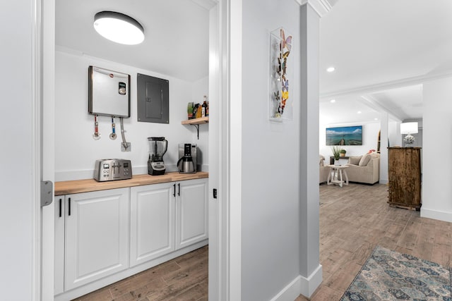 1610 Von Phister St, Key West, FL 33040 - corridor featuring electric panel, light wood-type flooring, baseboards, and recessed lighting