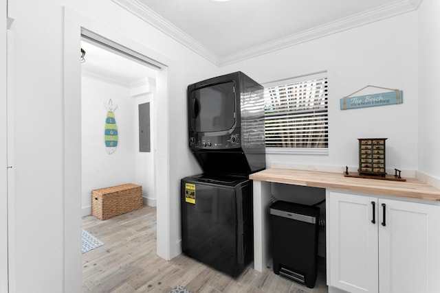 1610 Von Phister St, Key West, FL 33040 - kitchen with butcher block countertops, stacked washer / dryer, ornamental molding, light wood-type flooring, and electric panel