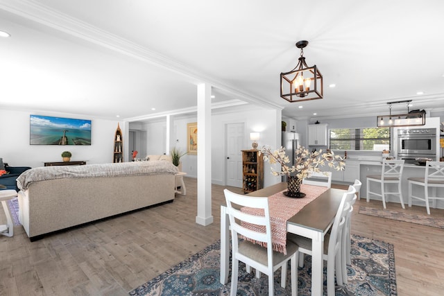 1610 Von Phister St, Key West, FL 33040 - dining room featuring a chandelier, light wood-type flooring, crown molding, and recessed lighting