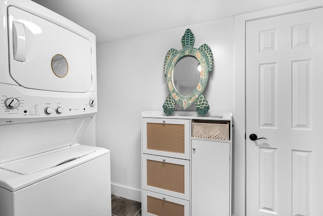 1610 Von Phister St, Key West, FL 33040 - laundry room featuring stacked washer / drying machine, baseboards, and dark tile patterned flooring