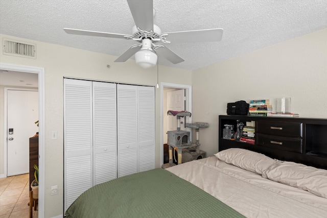 3635 Seaside Dr Unit 314, Key West, FL 33040 - bedroom featuring a textured ceiling, a closet, a ceiling fan, and visible vents