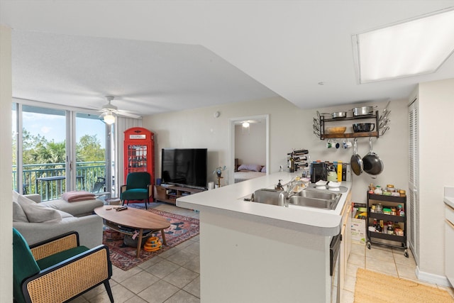 3635 Seaside Dr Unit 314, Key West, FL 33040 - kitchen with light tile patterned floors, open floor plan, ceiling fan, and light countertops