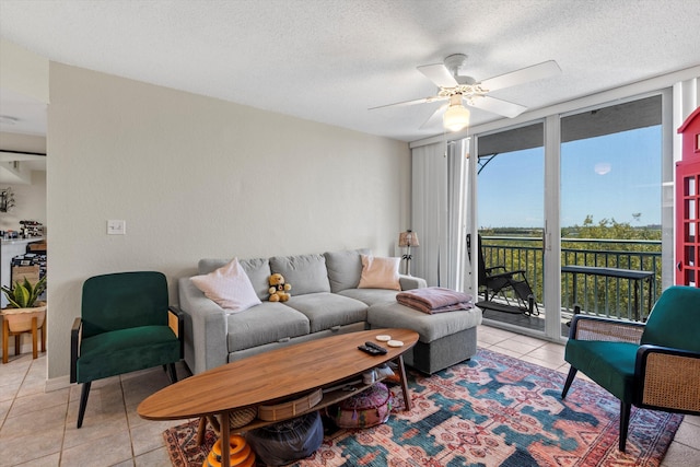 3635 Seaside Dr Unit 314, Key West, FL 33040 - living room with a ceiling fan, light tile patterned flooring, and a textured ceiling