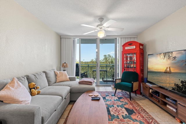 3635 Seaside Dr Unit 314, Key West, FL 33040 - living area with a ceiling fan, a textured ceiling, light tile patterned flooring, and floor to ceiling windows