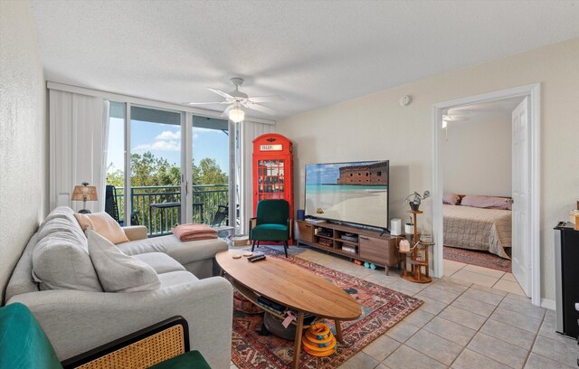 3635 Seaside Dr Unit 314, Key West, FL 33040 - living area featuring light tile patterned floors and ceiling fan