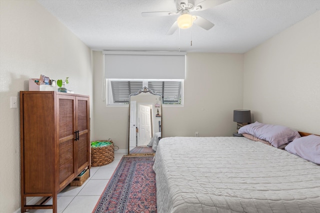 3635 Seaside Dr Unit 314, Key West, FL 33040 - bedroom with a textured ceiling, light tile patterned floors, and ceiling fan