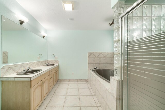 bathroom featuring tile patterned flooring, vanity, and plus walk in shower