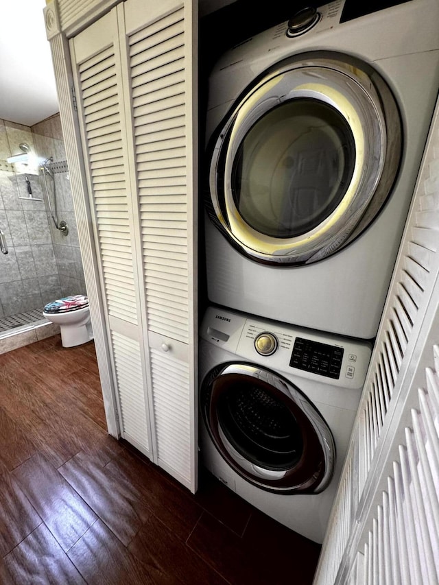 318 Margaret St, Key West, FL 33040 - washroom with stacked washer / dryer and dark wood-style flooring