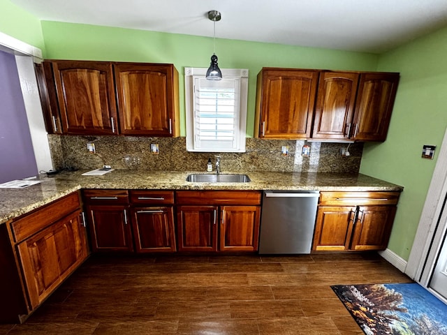 318 Margaret St, Key West, FL 33040 - kitchen featuring stainless steel dishwasher, a sink, backsplash, light stone counters, and decorative light fixtures