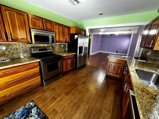 318 Margaret St, Key West, FL 33040 - kitchen with stainless steel appliances, a sink, backsplash, and dark wood finished floors