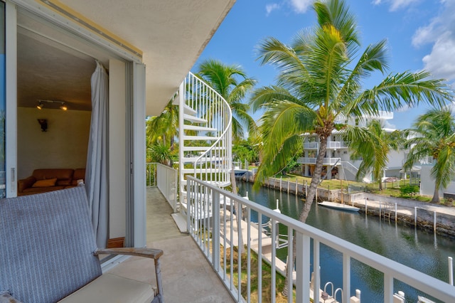 balcony featuring a water view