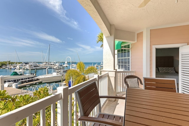 balcony featuring a water view