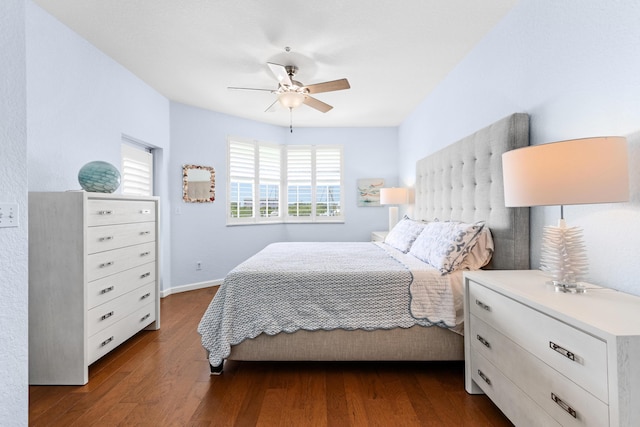 bedroom with ceiling fan and dark hardwood / wood-style flooring