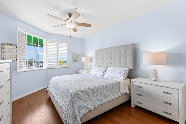 bedroom featuring ceiling fan and dark hardwood / wood-style flooring