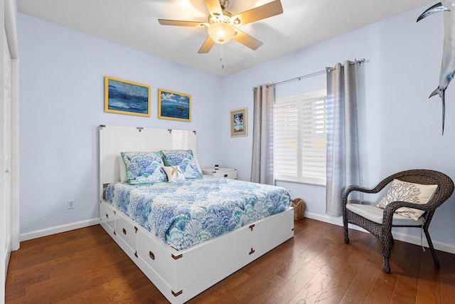 bedroom with dark wood-type flooring and ceiling fan