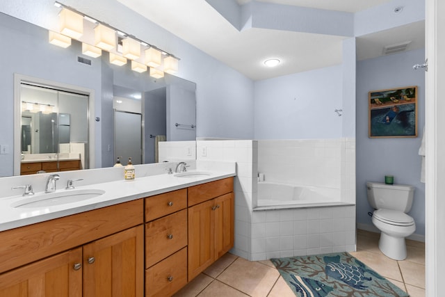 full bathroom featuring tile patterned floors, toilet, vanity, and shower with separate bathtub