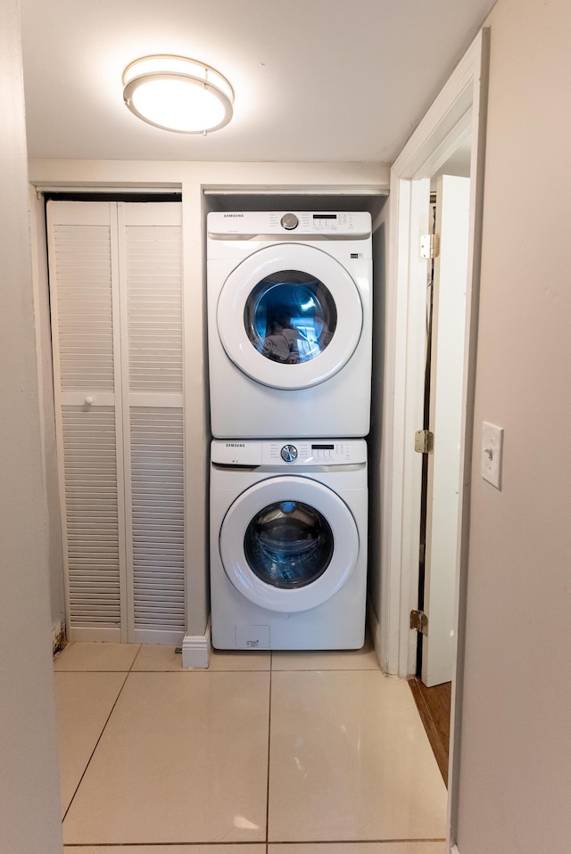 3314 Northside Dr Unit 31, Key West, FL 33040 - laundry area featuring stacked washer and clothes dryer and tile patterned floors