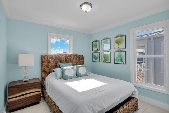 tiled bedroom featuring ornamental molding