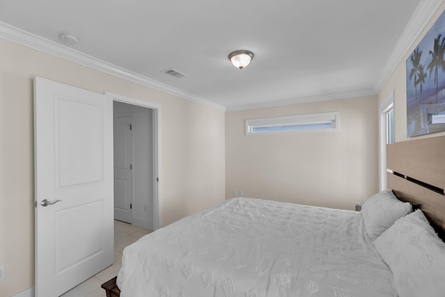 bedroom with light tile patterned floors and ornamental molding