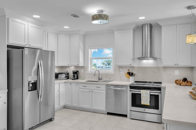 kitchen featuring wall chimney exhaust hood, stainless steel appliances, sink, and white cabinets