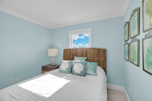 bedroom featuring ornamental molding and light tile patterned floors