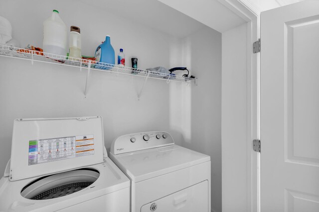 laundry area with independent washer and dryer