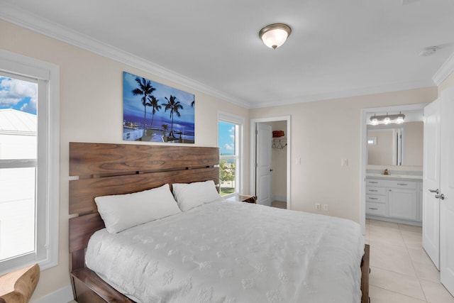 bedroom with connected bathroom, sink, crown molding, and light tile patterned floors