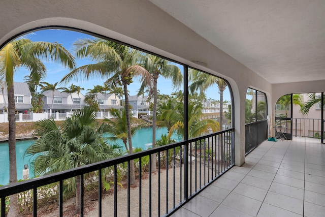 balcony with a water view and a residential view