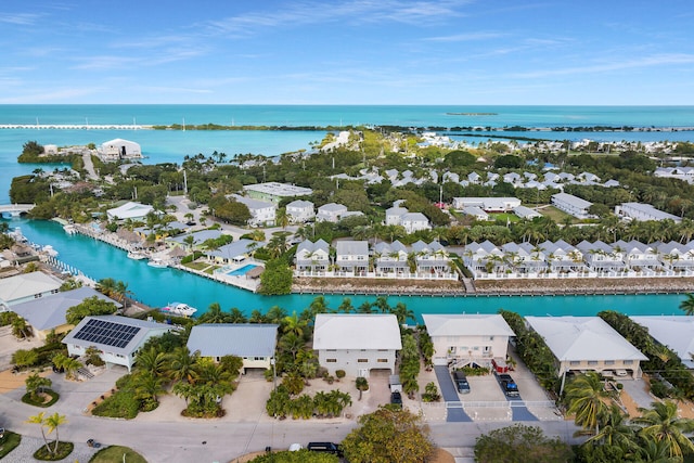 drone / aerial view with a residential view and a water view