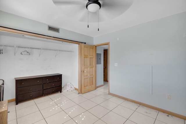 bedroom with light tile patterned flooring, a ceiling fan, visible vents, baseboards, and electric panel