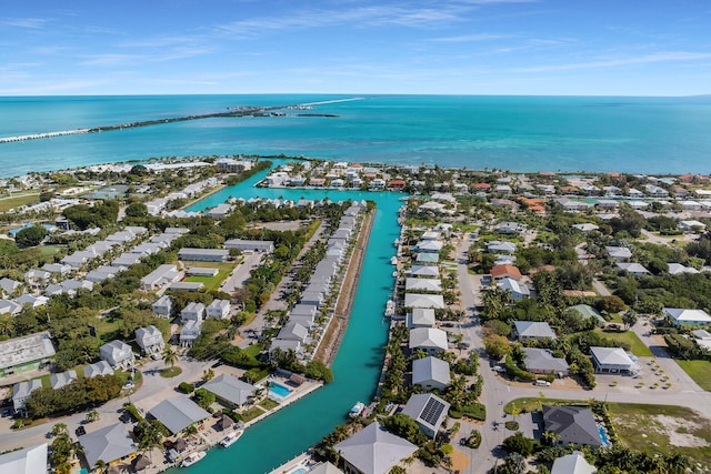 drone / aerial view with a water view and a residential view