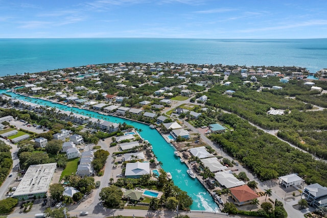 birds eye view of property with a water view and a residential view