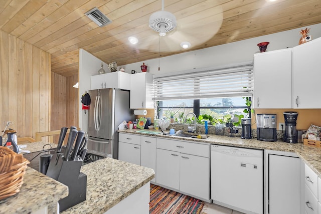 kitchen featuring visible vents, freestanding refrigerator, wood ceiling, white cabinetry, and white dishwasher