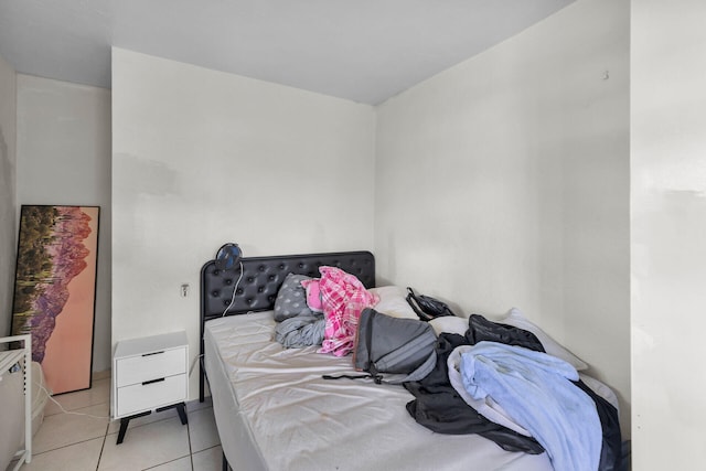 bedroom featuring light tile patterned floors