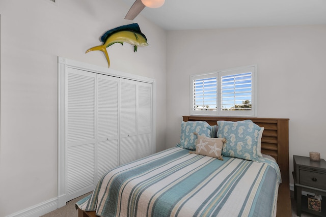 bedroom with a closet, ceiling fan, and carpet flooring