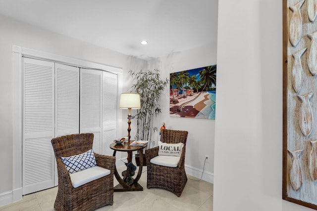 sitting room featuring light tile patterned flooring