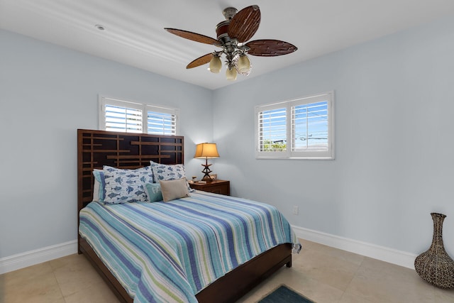 tiled bedroom with ceiling fan