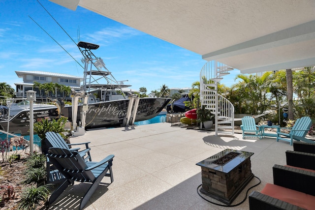 view of patio with an outdoor fire pit