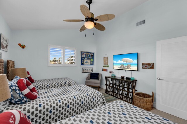 bedroom with ceiling fan and vaulted ceiling