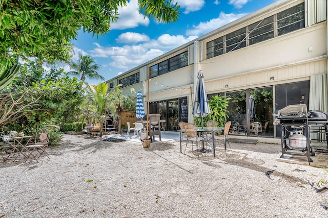 rear view of property featuring a patio