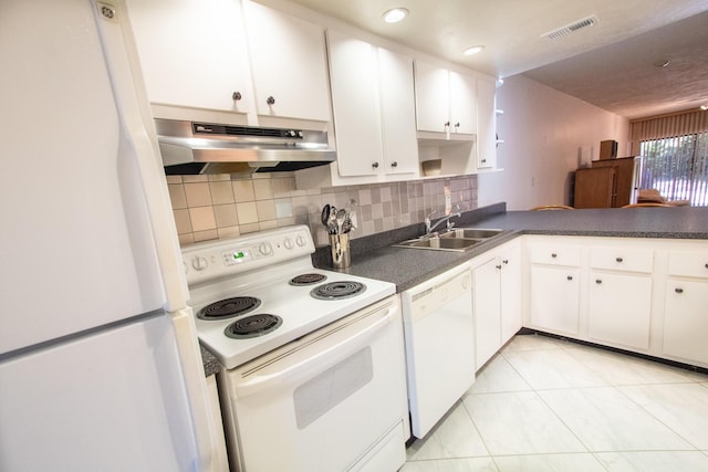 kitchen featuring sink, light tile patterned floors, white appliances, decorative backsplash, and white cabinets