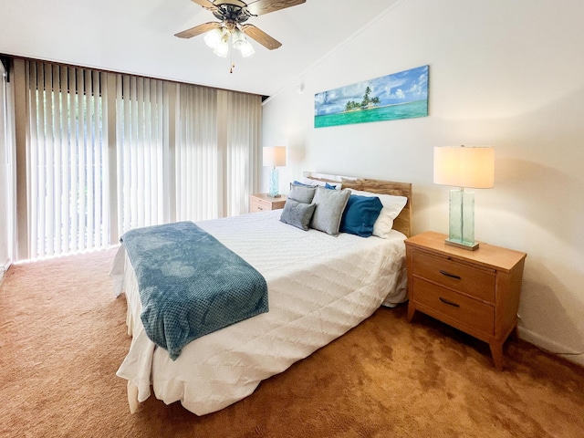 bedroom with vaulted ceiling, ceiling fan, and carpet flooring