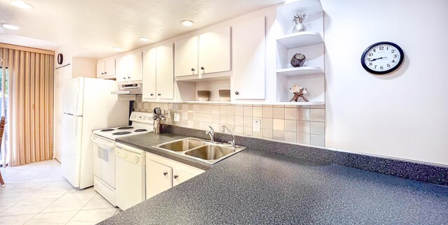 kitchen with light tile patterned flooring, sink, white cabinetry, white appliances, and backsplash