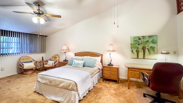 carpeted bedroom featuring ceiling fan and vaulted ceiling