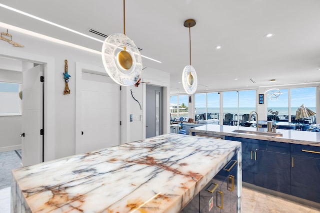 257 Normandy Dr, Tavernier, FL 33070 - kitchen featuring blue cabinets, a sink, recessed lighting, pendant lighting, and open floor plan