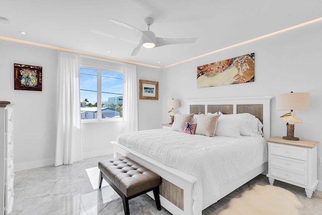 257 Normandy Dr, Tavernier, FL 33070 - bedroom featuring light marble finish floors, a ceiling fan, and baseboards