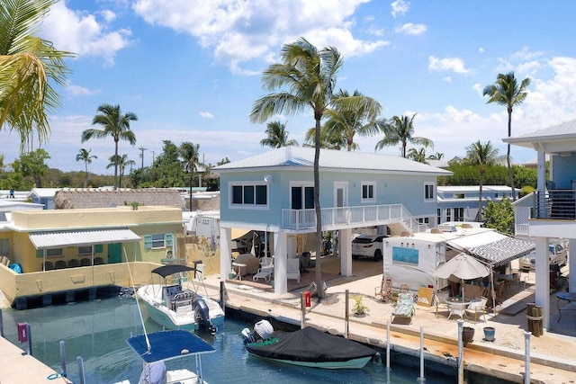 rear view of property featuring a water view