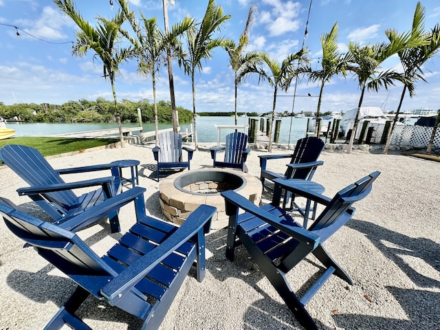 view of patio / terrace featuring a water view and an outdoor fire pit