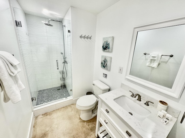 bathroom with vanity, toilet, and an enclosed shower