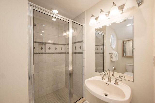 202 Admirals Ln, Key West, FL 33040 - full bathroom featuring a sink, toilet, and a stall shower